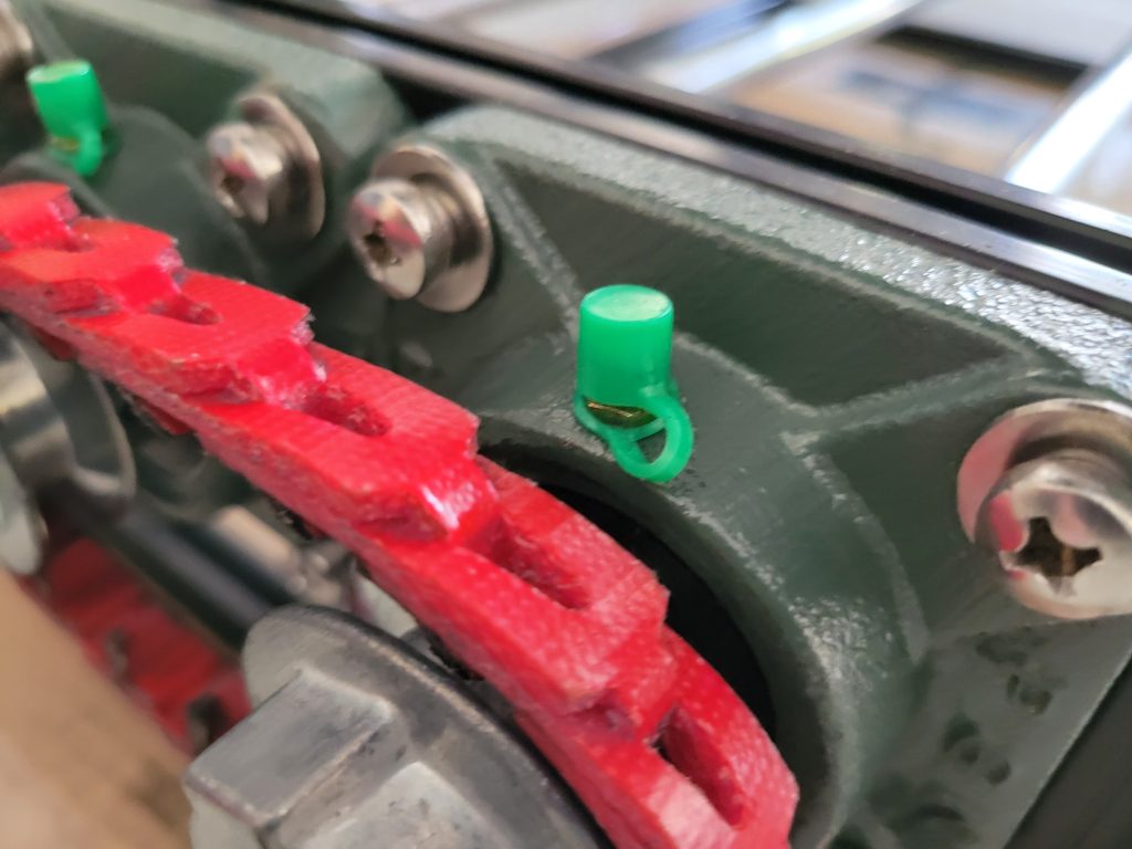 Close detail of the belt and pulley path on the custom rock tumbler roller end.