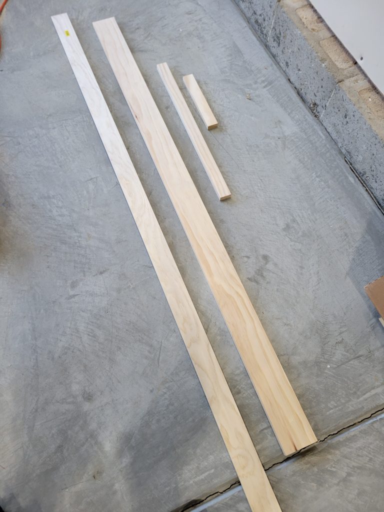 Pine strips laid out before being assembled into the clock face
