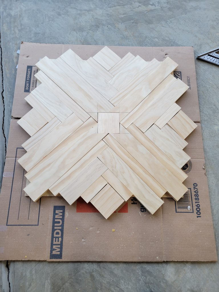 Additional pine strips before the abstract clock face was built