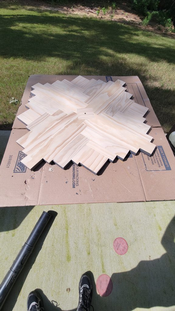 Jagged abstract wall clock face after the pine strips were shaped
