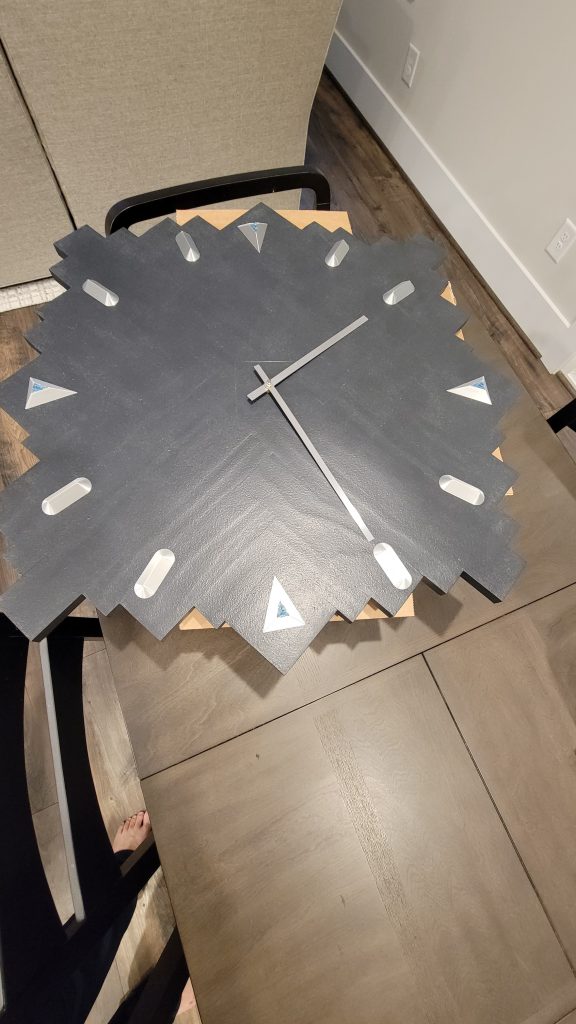Finished wall clock face with the hands and movement installed