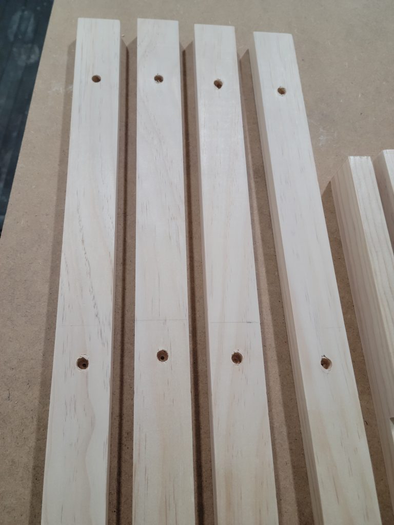 Drilled frame pieces ready for assembly.