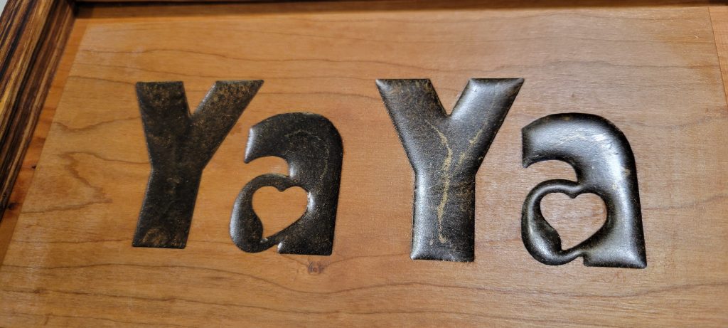 Close-up of the CNC engraved YaYa lid after the epoxy resin fill