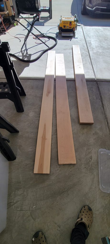 Raw lumber laid out for the nightstand.