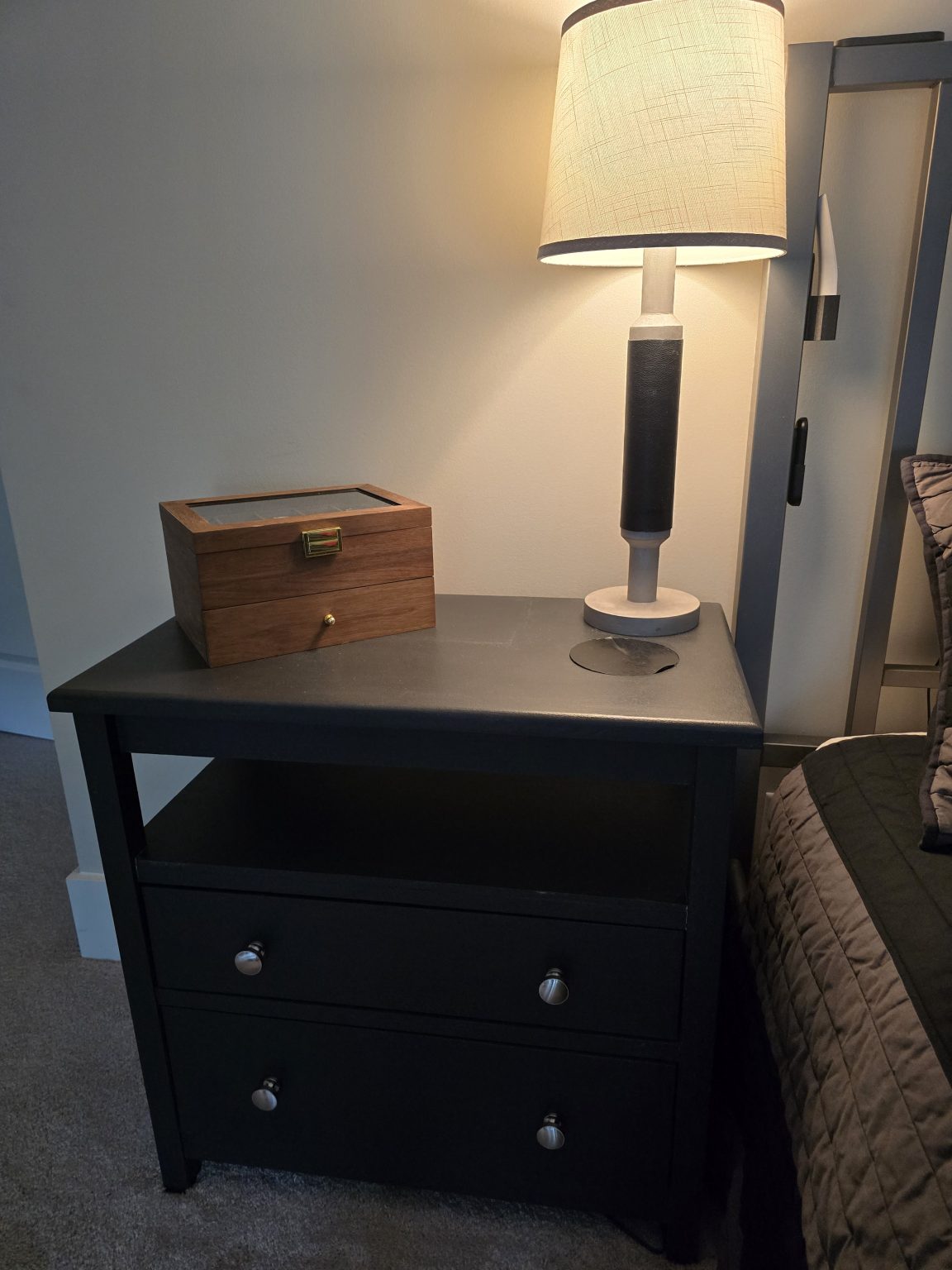 Finished nightstand installed beside the bed.