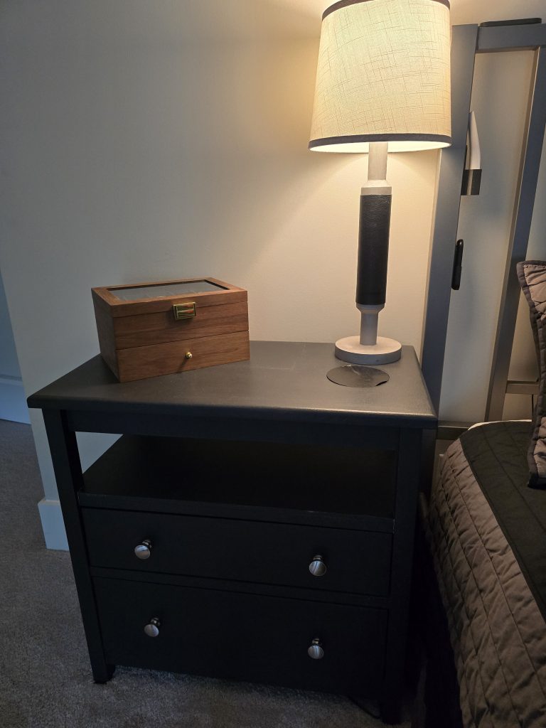 Finished nightstand installed beside the bed.
