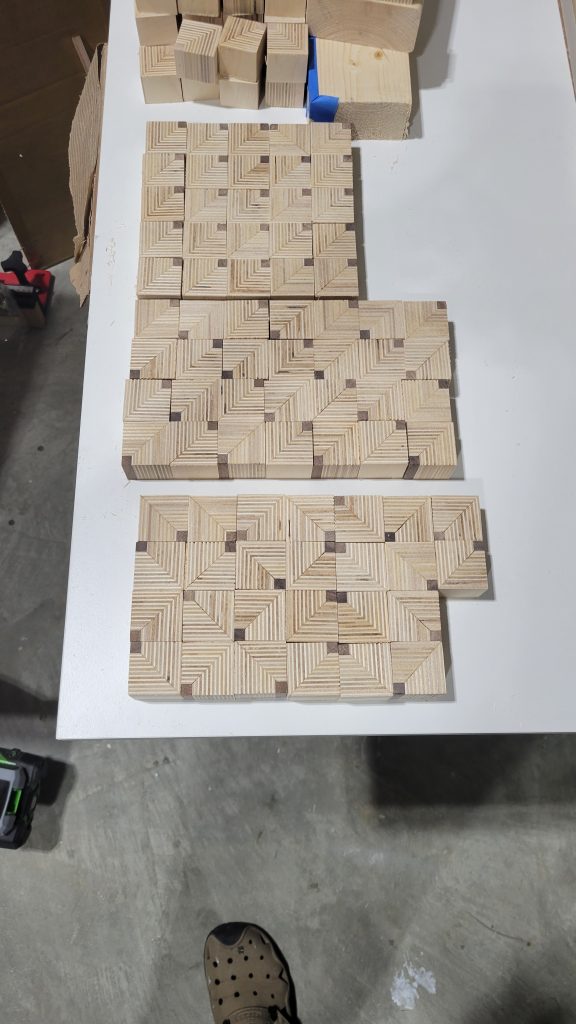Patterned plywood and walnut slices glued into panel sections for the side table.