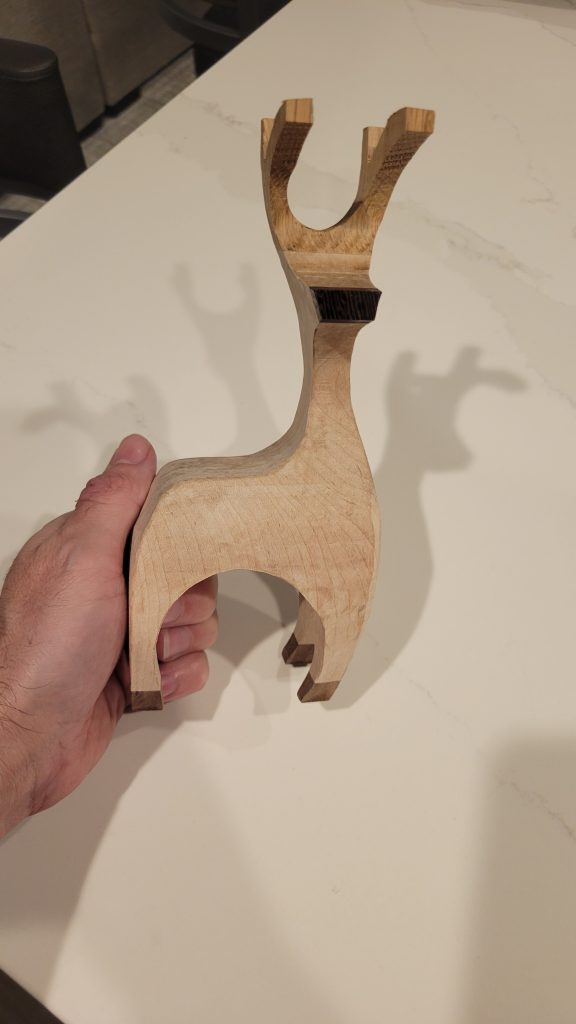 Close view of a hardwood reindeer showing contrast from the glued-up stock.