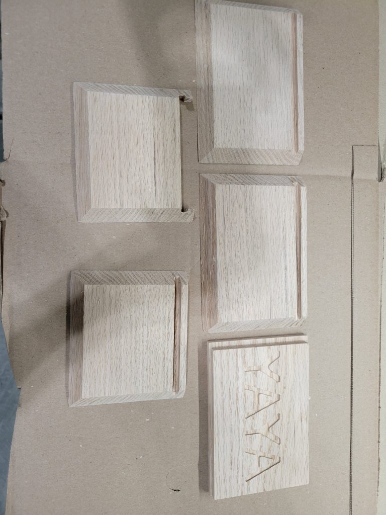 Unfinished wooden recipe box parts laid out before assembly and finishing