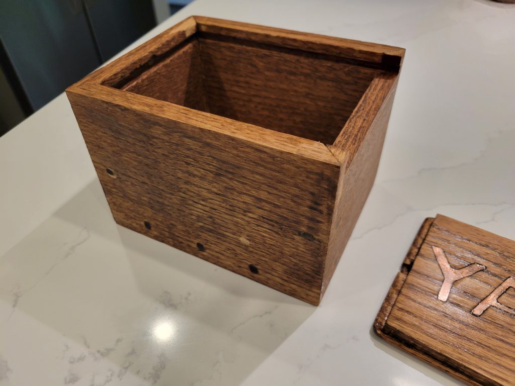 Open wooden recipe box showing the storage cavity for 3x5 recipe cards
