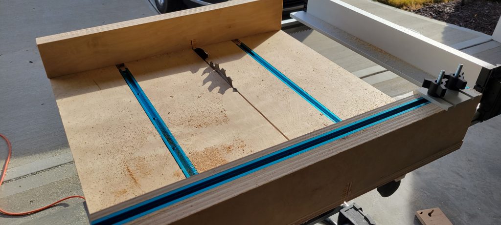 SawStop CTS crosscut sled in use at the blade.