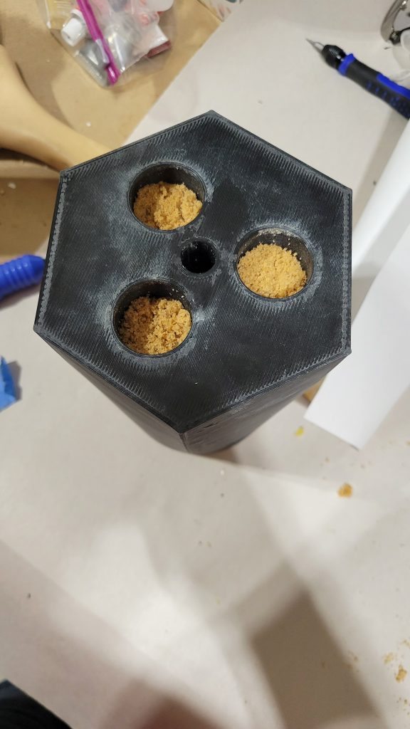 Hollow 3D printed lamp base filled with sand for stability.