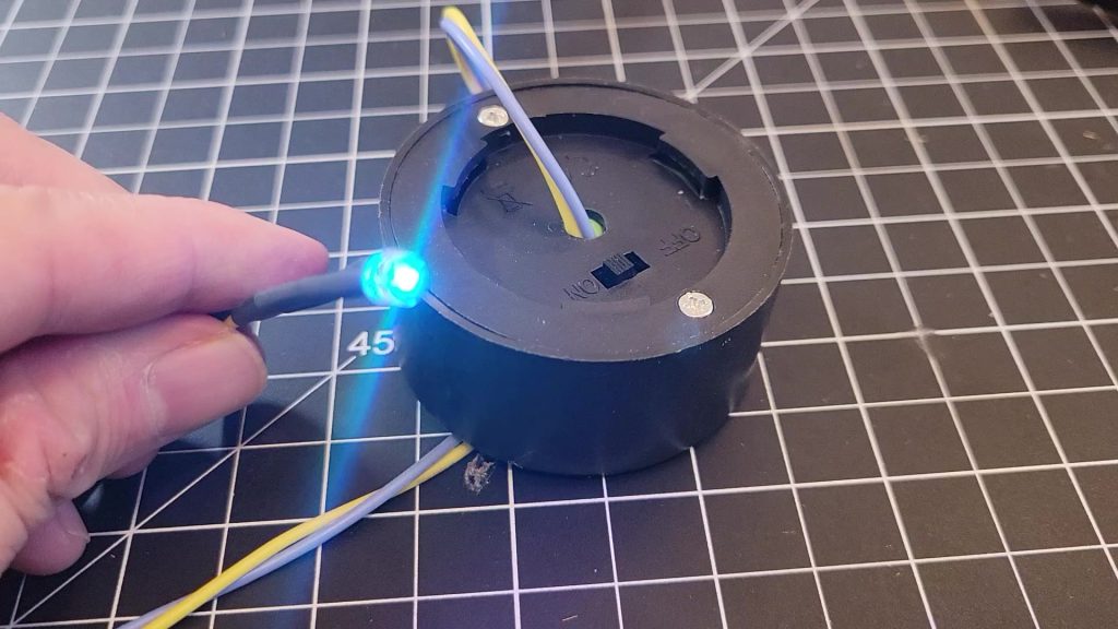 Still image of the solar LED being installed inside the birdhouse
