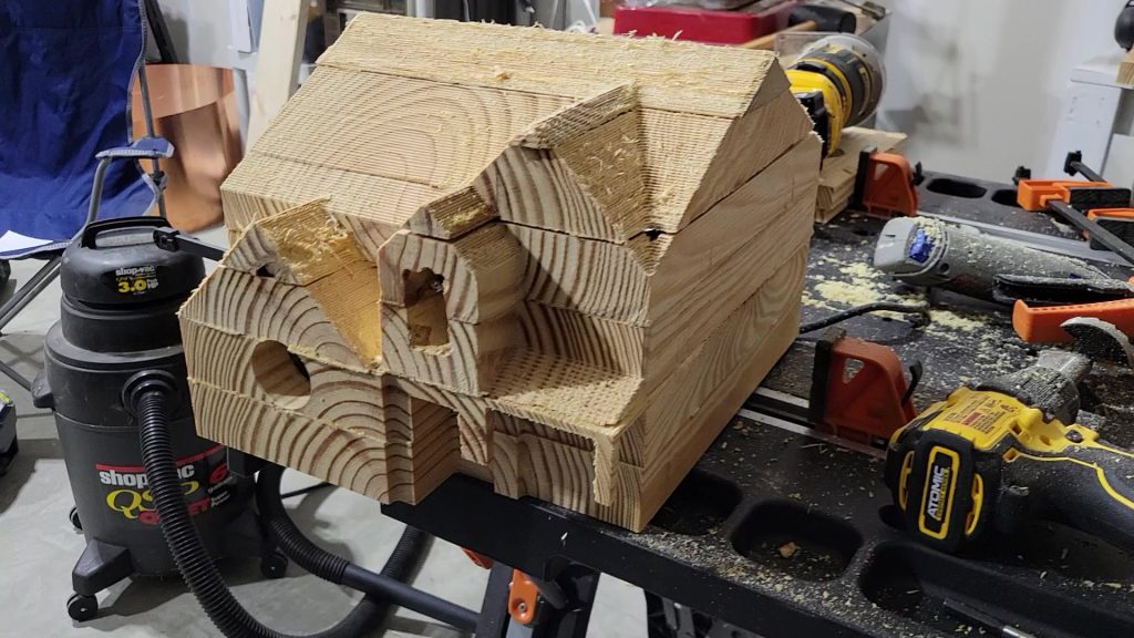 Still image of the carved birdhouse form taking shape